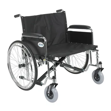 A black manual wheelchair with large rear wheels and small front caster wheels.