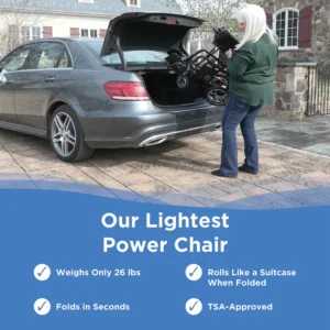 Woman loading a light power wheelchair into a car trunk outdoors.