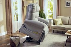 A recliner chair in the middle of a living room.