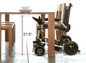 A wheelchair is shown next to a table.