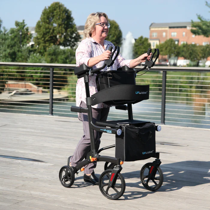 A woman riding in the back of a walker.
