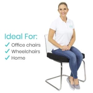 A woman sitting on top of a black chair.