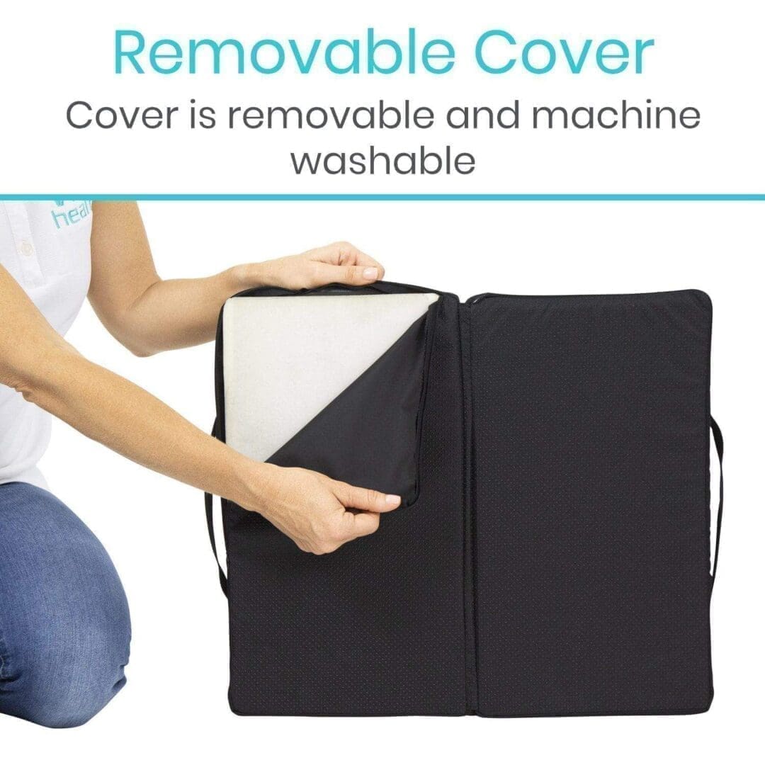 A woman holding onto the cover of her laptop
