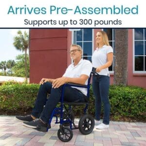 A man in a wheelchair with woman standing next to him.