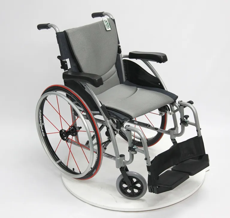 A modern manual wheelchair with padded seat and footrests.