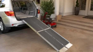 Portable ramp extending from a car to a porch for easy access.