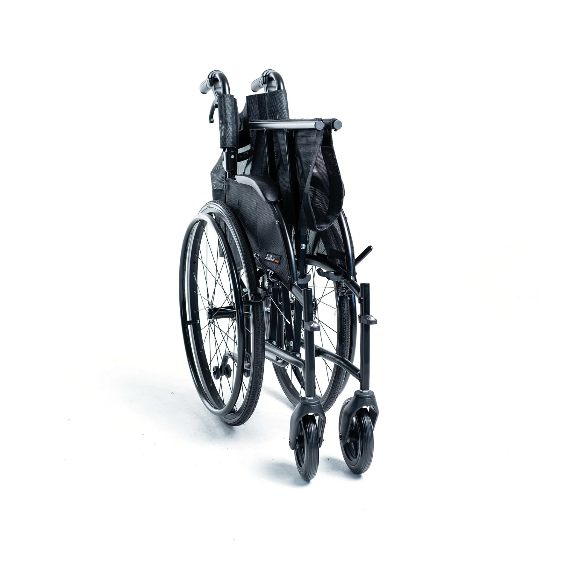 Black manual wheelchair isolated on white background.