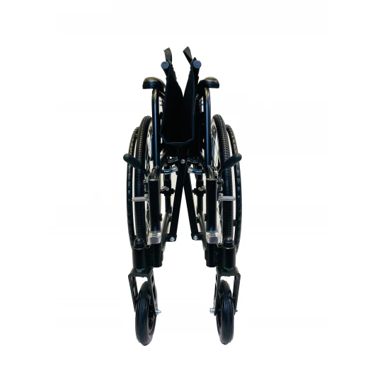Folded black wheelchair with footrests and large rear wheels.