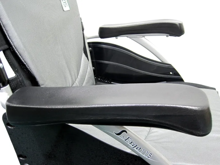 Close-up of a modern office chair armrest and seat.