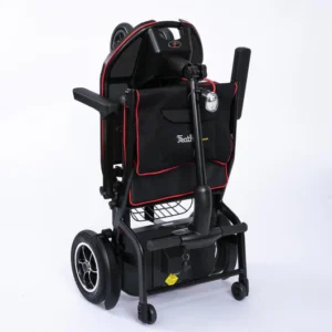 Compact, foldable electric wheelchair with black and red design.