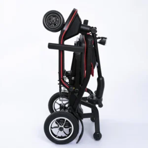 Folded black and red electric scooter with large wheels.