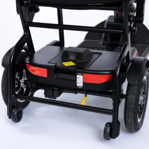 Close-up of the rear section of a wheelchair with footrests and brakes.