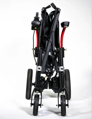 Rear view of a folded black stroller with red accents and wheels.
