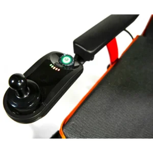 Close-up of a joystick controller on a gaming chair armrest.