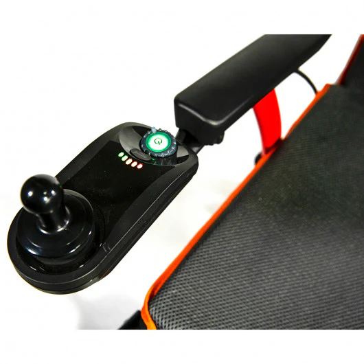 Close-up of a joystick controller on a gaming chair armrest.