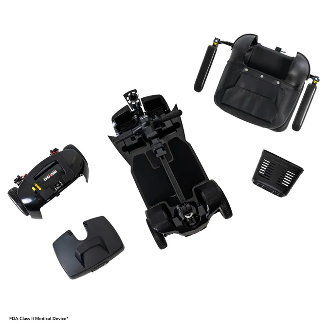 Disassembled black mechanical or electronic device parts isolated on white.