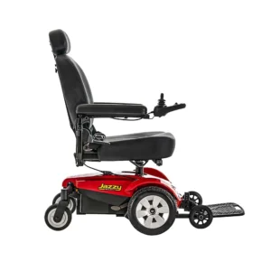 Red and black electric wheelchair with adjustable armrests and footrest.