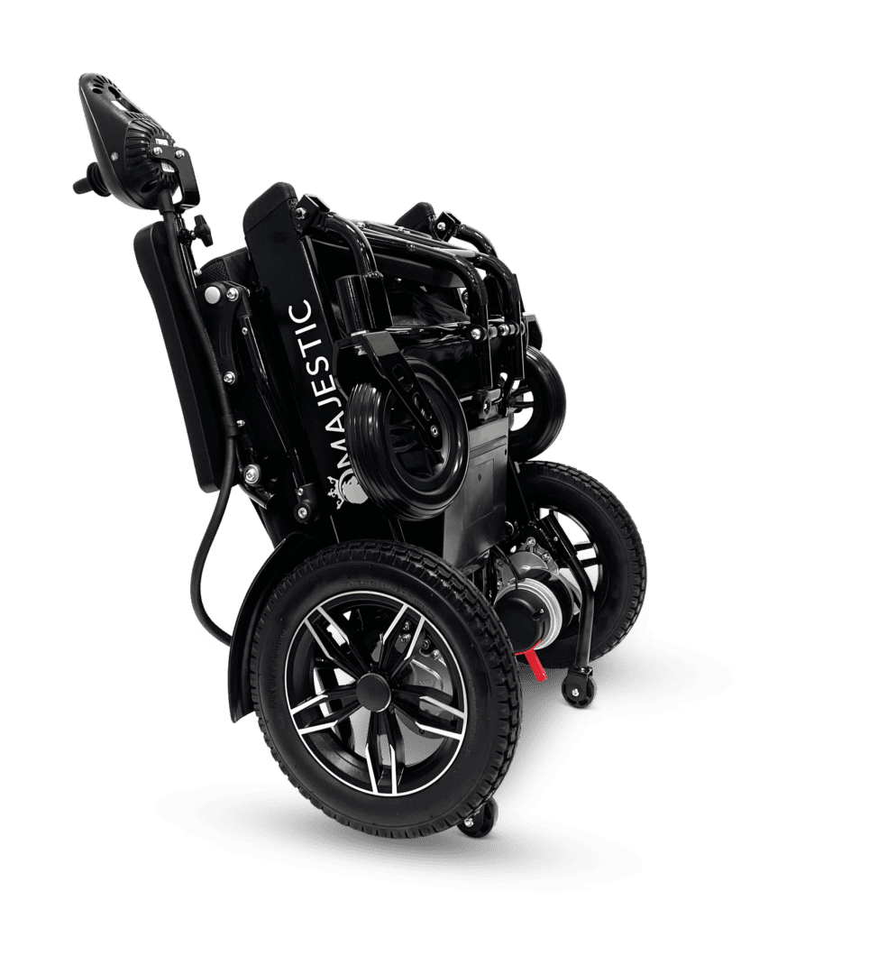 Compact black mechanical device with wheels and intricate components.