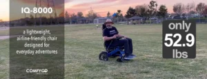 Person enjoying a ride on a motorized wheelchair in a park at sunset.