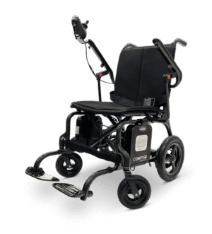 A motorized wheelchair with caterpillar tracks for rough terrain.