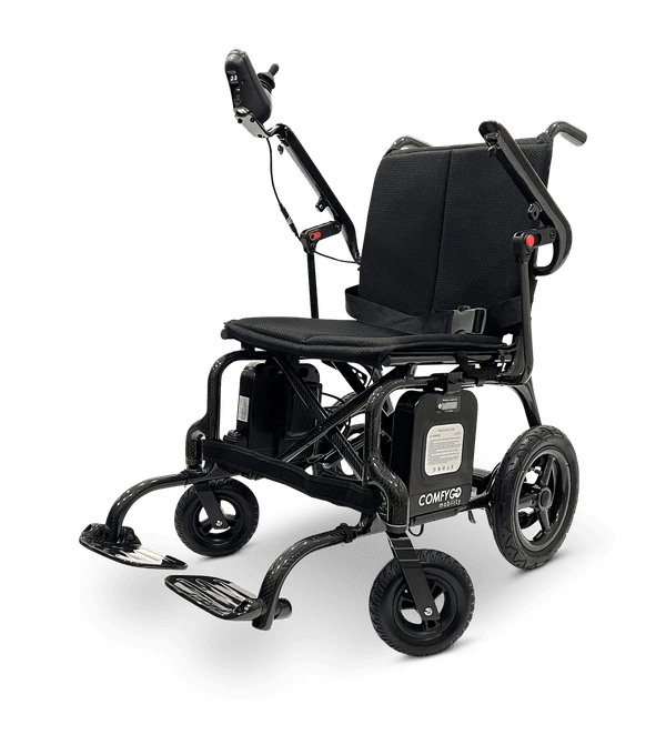 A motorized wheelchair with caterpillar tracks for rough terrain.
