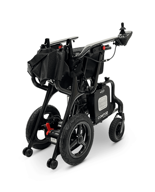 Folded black electric mobility scooter with large wheels and handlebar.