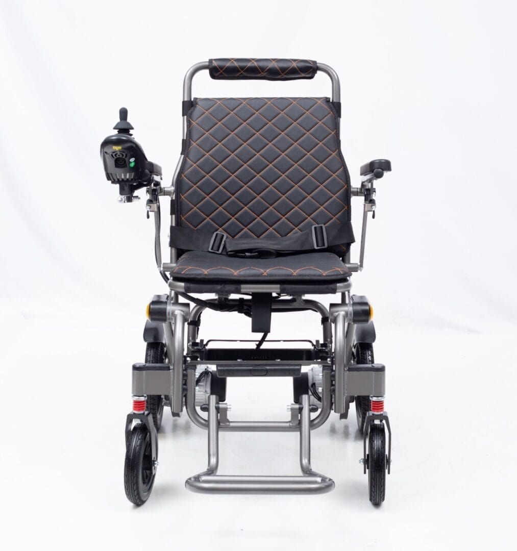 Modern electric wheelchair with black cushioned seat and joystick control.