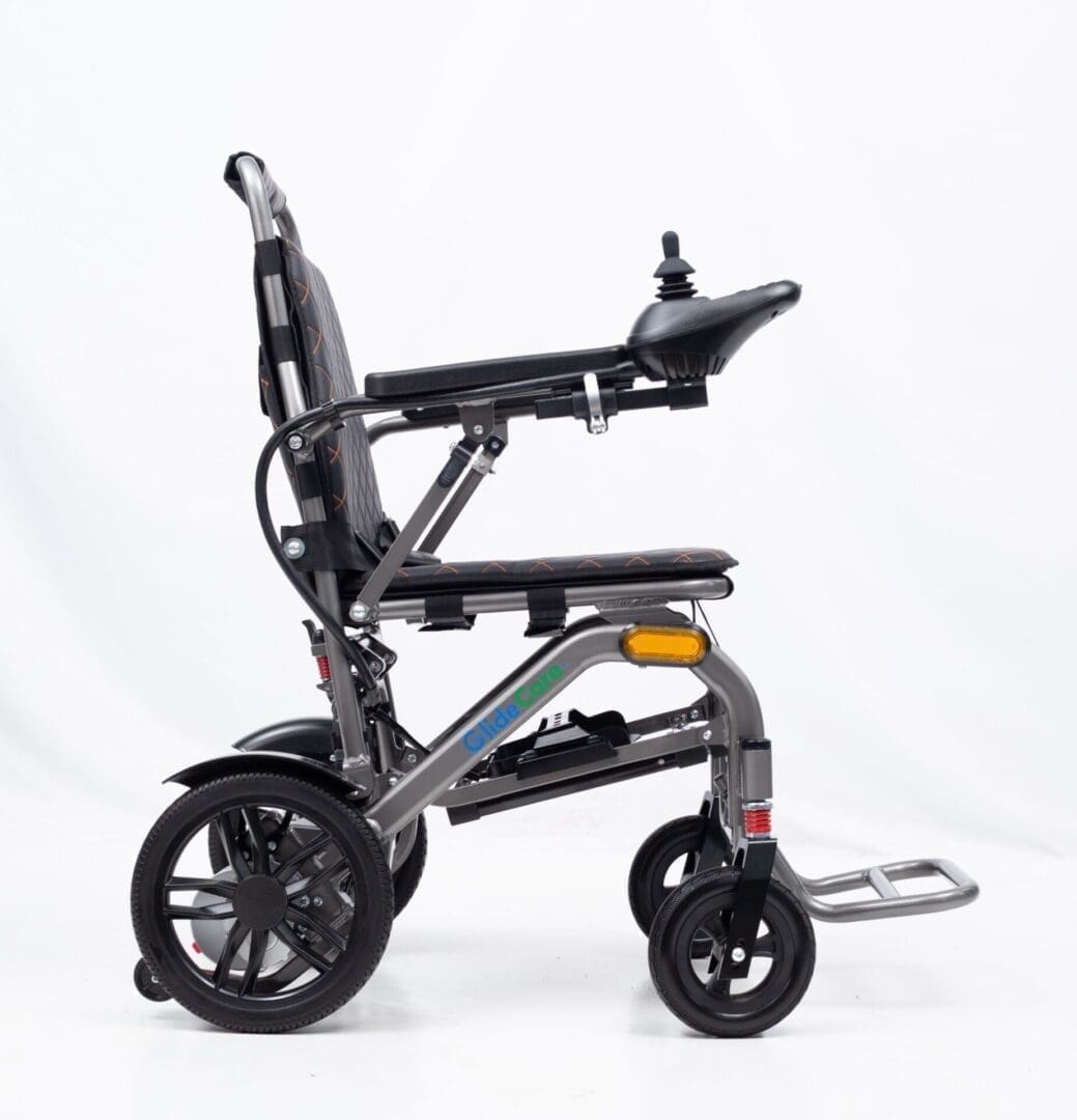 Compact black mobility scooter with three wheels and ergonomic seat.