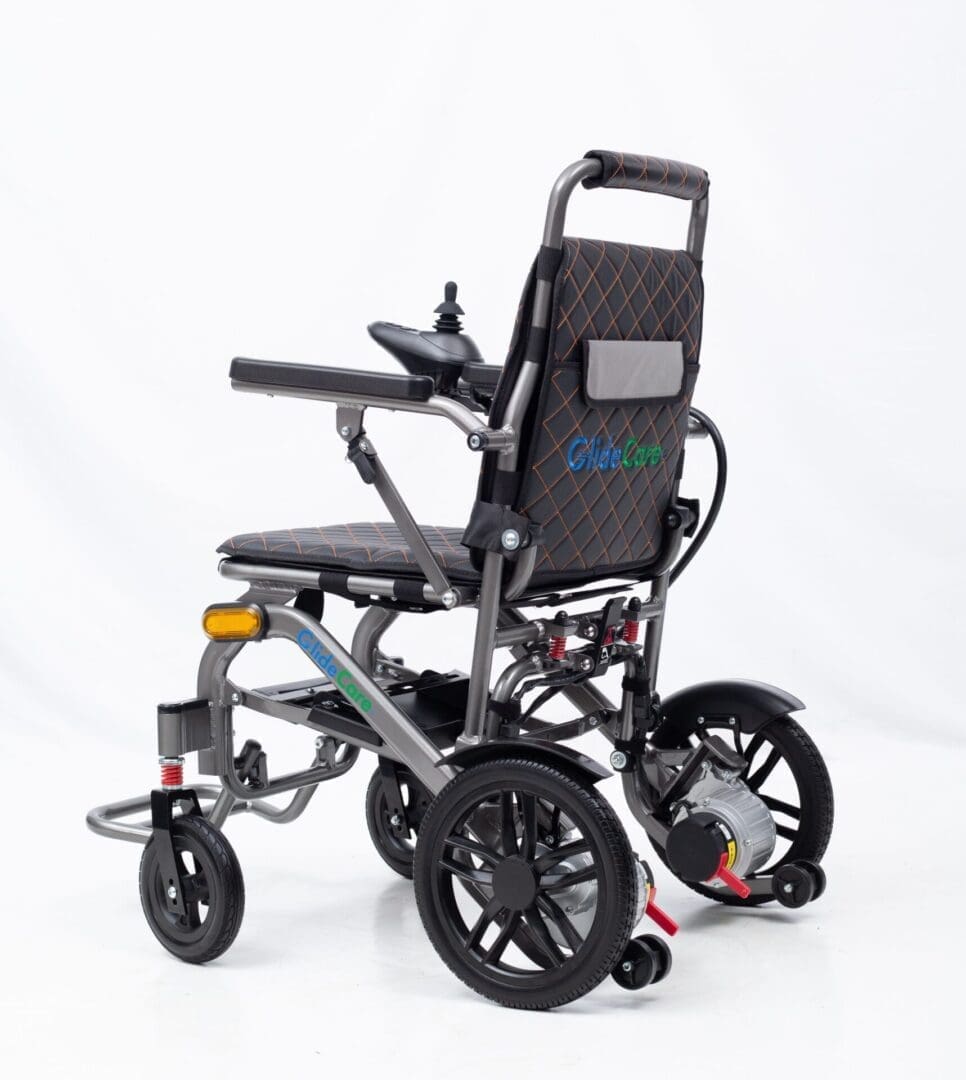 Modern electric wheelchair with black and gray design and large rear wheels.