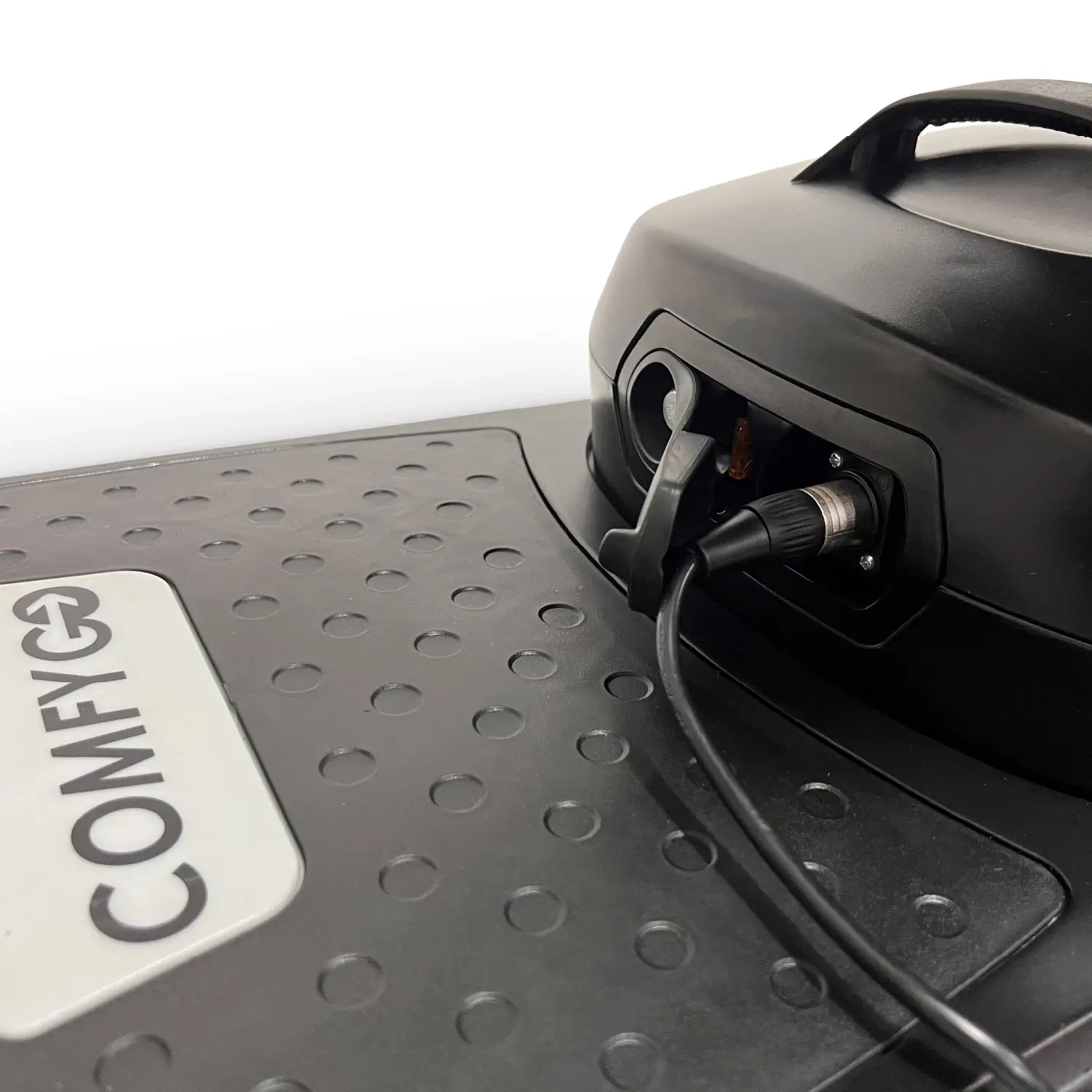 Black electronic device with a cable and COMFY label.