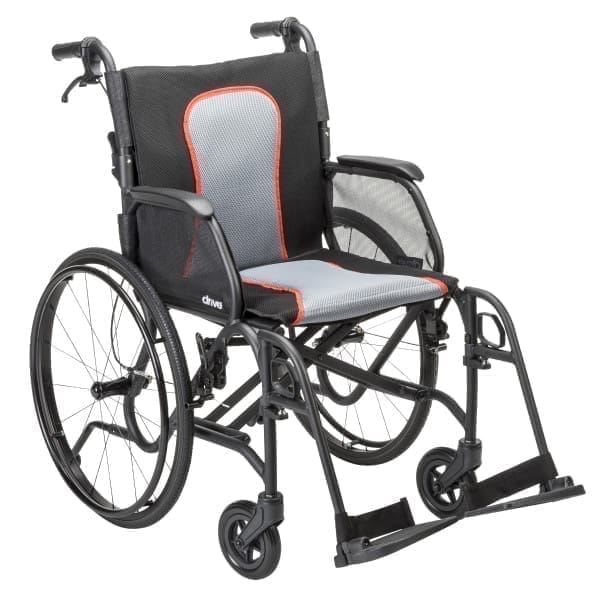 A modern black and gray wheelchair with red accents.