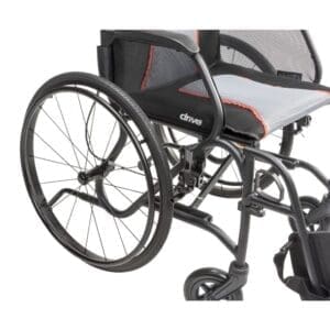 Modern manual wheelchair with large rear wheels and cushioned seat.