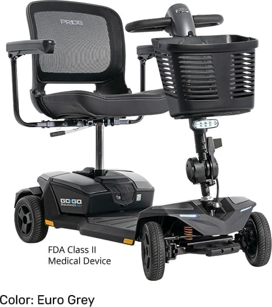 Compact black mobility scooter with basket and armrests.