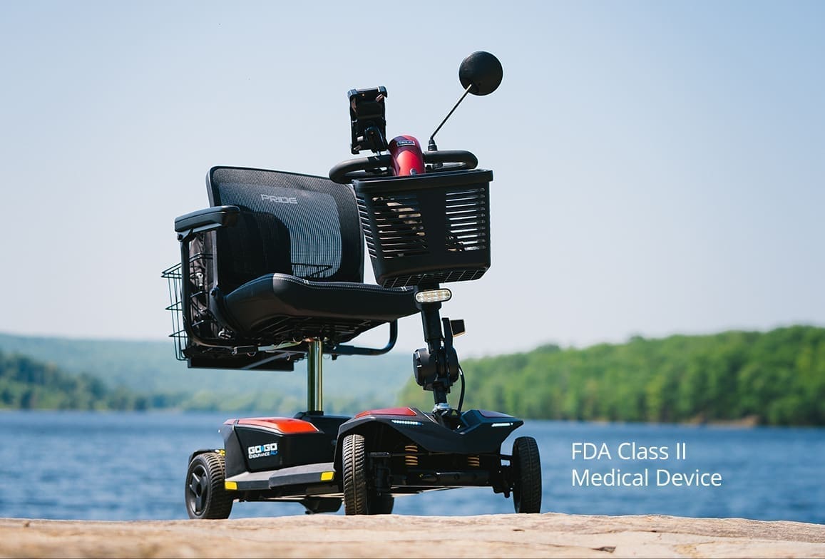 A robotic device with cameras and sensors on a small wheeled platform outdoors.