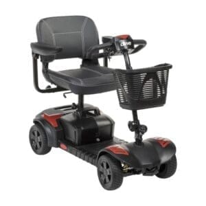 Compact four-wheeled mobility scooter with basket and padded seat.