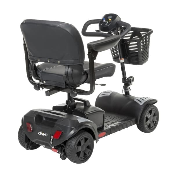 Mobility scooter with four wheels and a basket on the front.