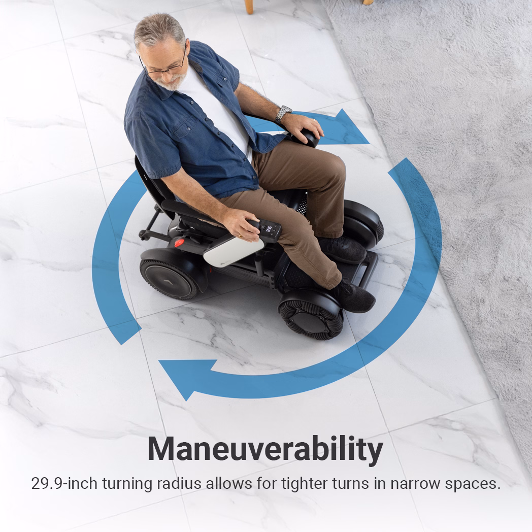 Man demonstrating maneuverability of a wheelchair in a tight space.