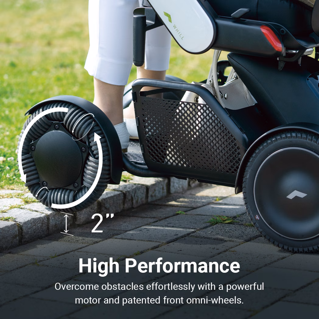 Close-up of a stroller wheel and mesh storage basket.