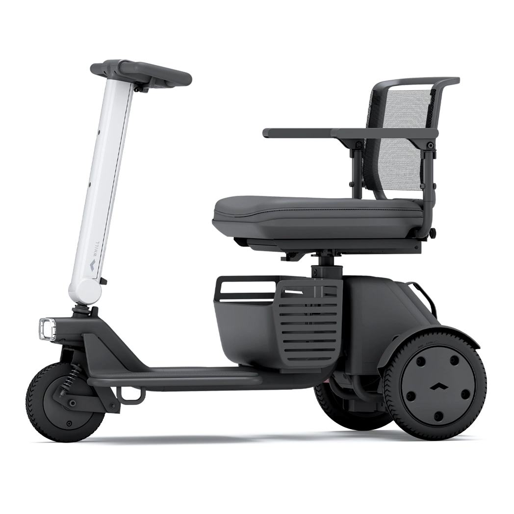Compact electric wheelchair with sturdy wheels and adjustable seating.