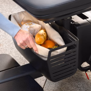 Person grilling vegetables on a barbecue grill.