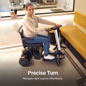 Woman using a mobility scooter indoors, making a precise turn.