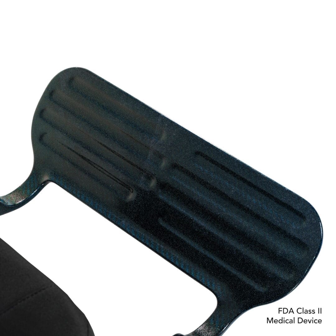 Black, ribbed, modern chair with metal armrest detail.