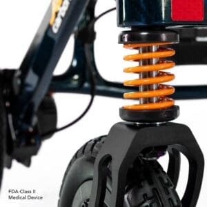Close-up of an electric scooter's rear suspension and wheel.