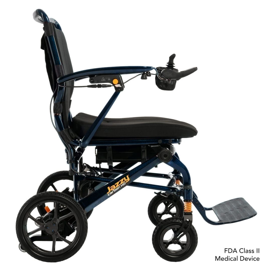 Compact black folding wheelchair with sturdy wheels and footrest.