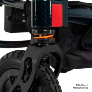 Close-up of a black electric scooter wheel and suspension system.