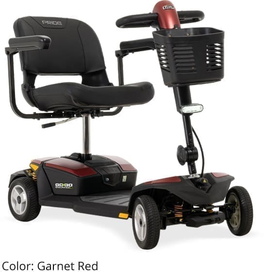 A compact, black mobility scooter with four wheels and a front basket.