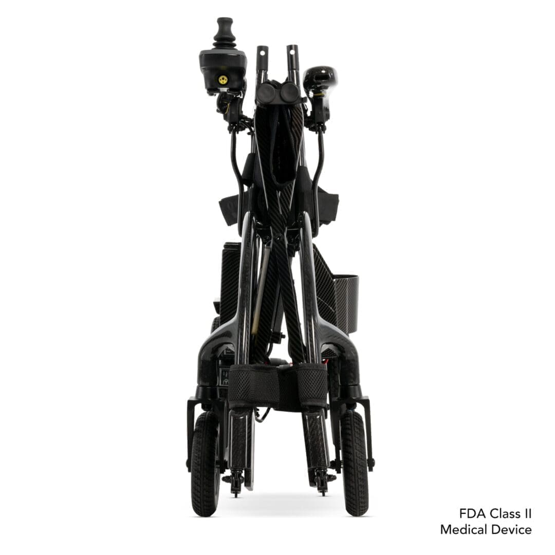 Folded black stroller viewed from the front against a white background.