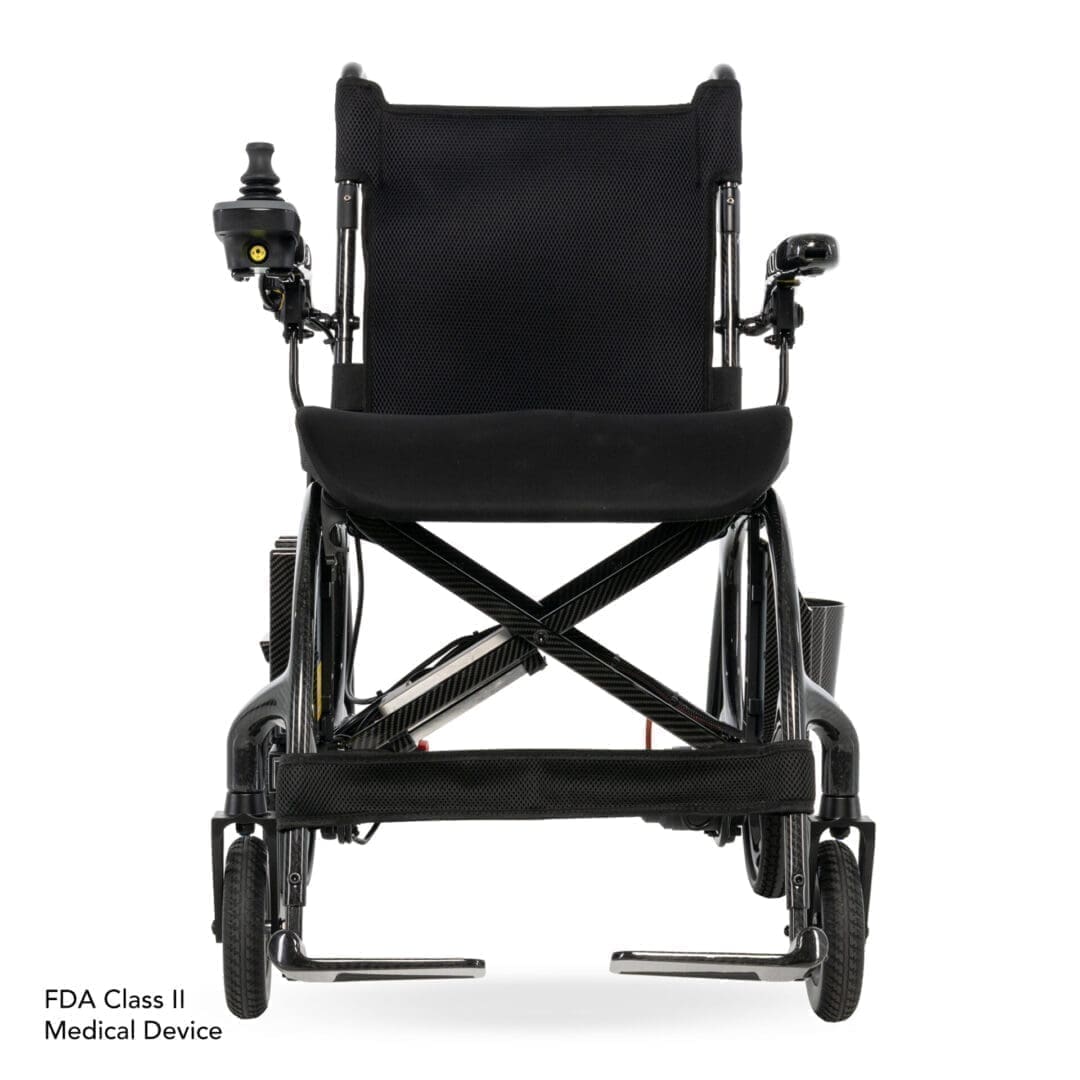 Black classic wheelchair with manual controls and footrests.